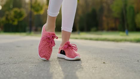 Handheld-view-of-woman-stretching-her-legs-before-jogging-training