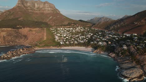 panorama of remote llandudno beach with judas’ peak in the background, cape town, south africa