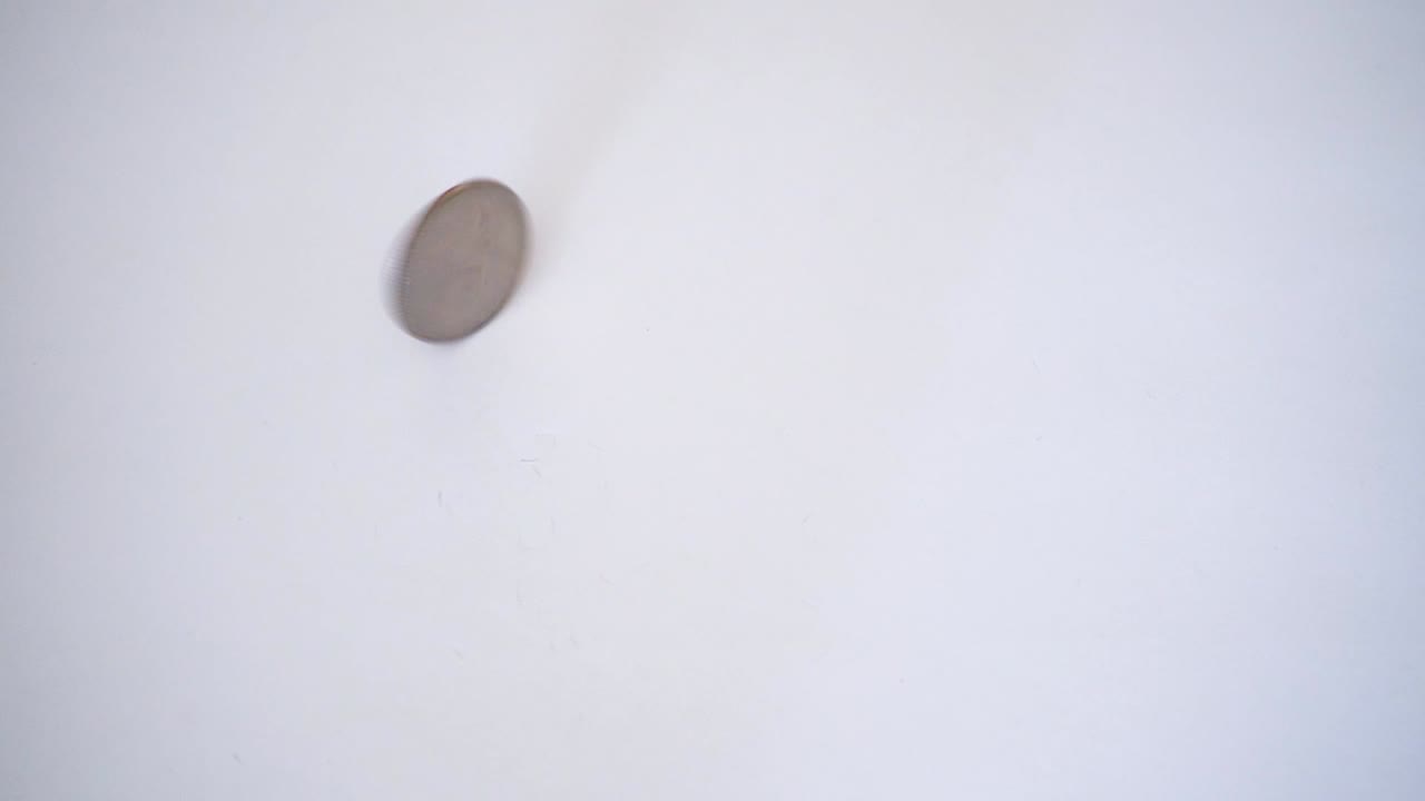 moneda de un cuarto de giro en cámara lenta