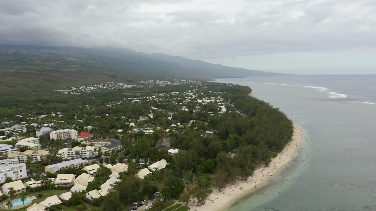 Stunning aerial view of tropical island coastline with coral reef and blue lagoon at Ermitage-les-Bains, Reunion Island, France