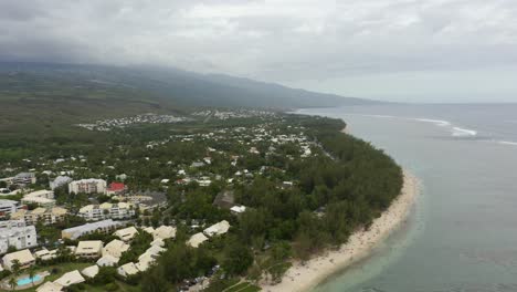 stunning aerial view of tropical island coastline with coral reef and blue lagoon at ermitage-les-bains, reunion island, france