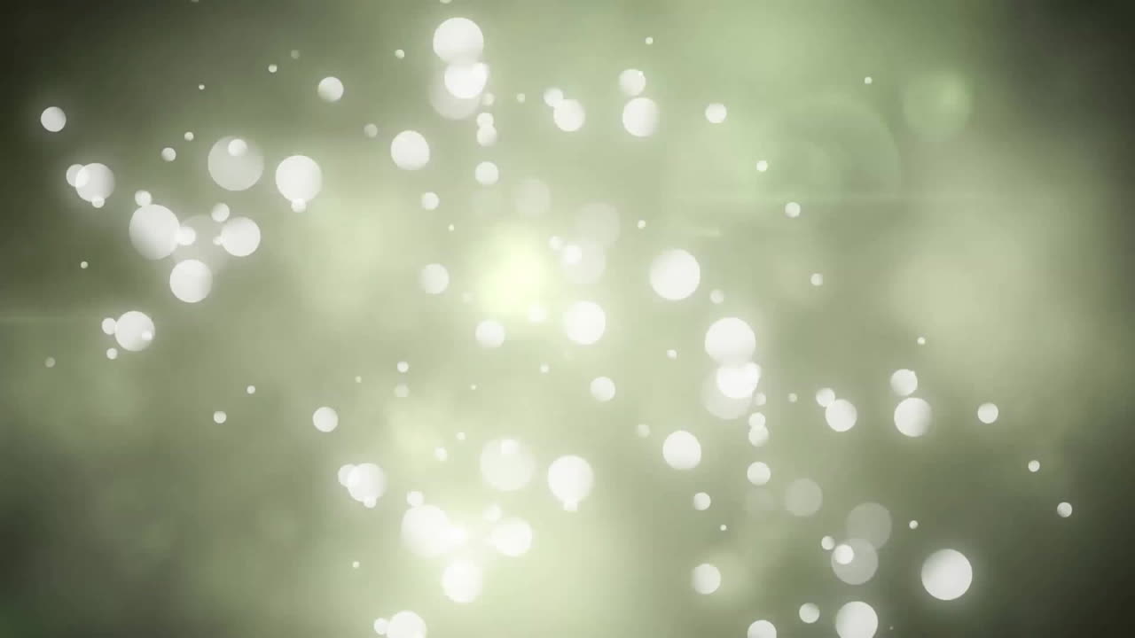 Animation of white spots moving on green background