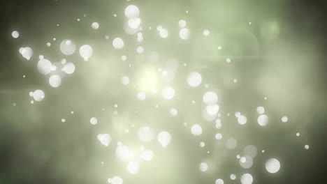 animation of white spots moving on green background