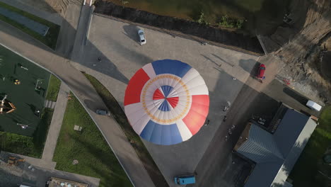 hot air balloon landing in a park