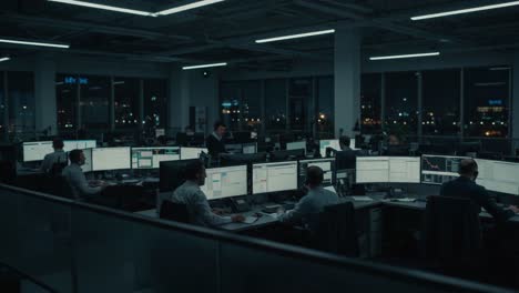 a night at the office: coordinated efforts of professionals in a dimly lit workspace showcasing modern technology and collaboration