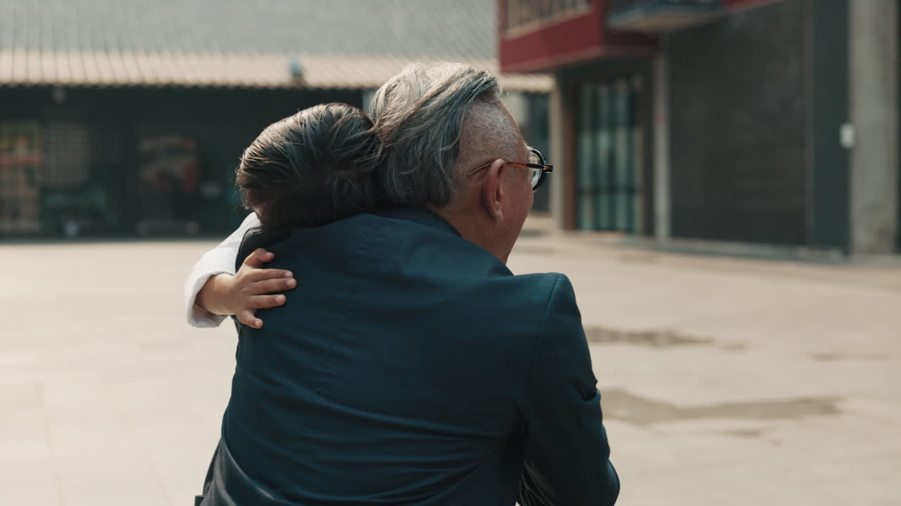 A touching moment between a grandfather and his grandson