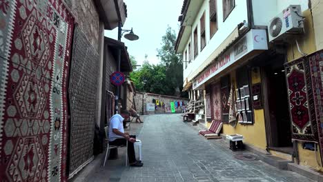 a vibrant display of turkish carpets and kilims in antalya’s old town, reflecting the artistry of turkish weaving traditions