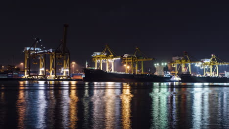 a 4k time lapse of container ships being loaded in bangkok port, thailand.