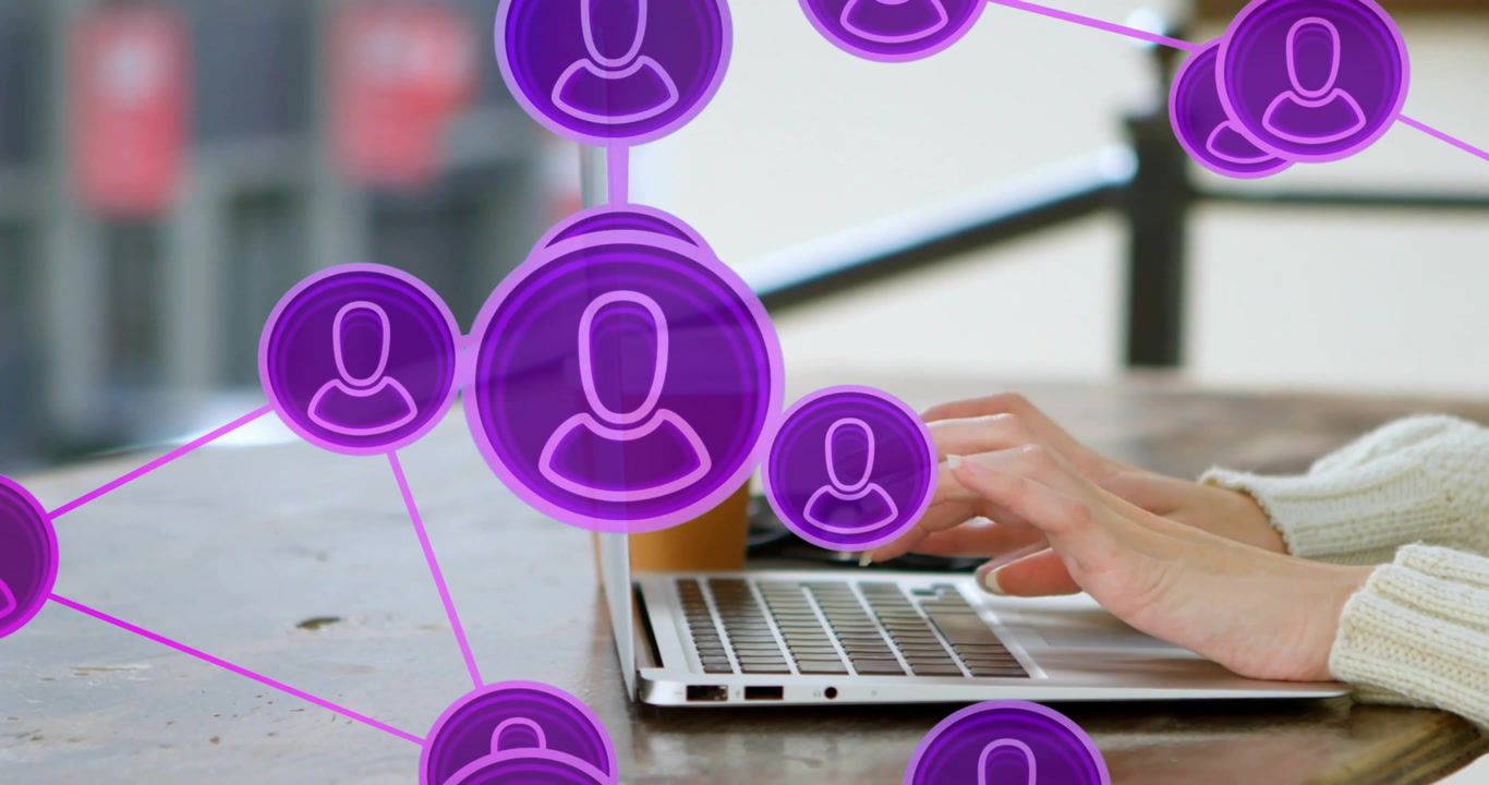 Woman typing on laptop at table, generating purple nodes growing, obscuring keyboard for networking