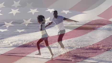 Animación-De-La-Bandera-De-Los-Estados-Unidos-De-América-Sobre-Un-Padre-Y-Una-Hija-Afroamericanos-En-La-Playa.