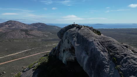 People-in-top-of-Frenchman-Mountain-enjoying-spectacular-view-on-Australian-Island-in-summer