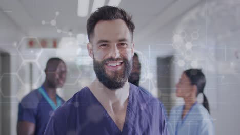 Animación-De-Datos-Médicos-Sobre-El-Retrato-De-Un-Médico-Barbudo-Sonriente-En-El-Pasillo-Del-Hospital