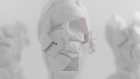three crushed android heads on spikes in white space