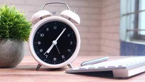 simple office desk setup with alarm clock