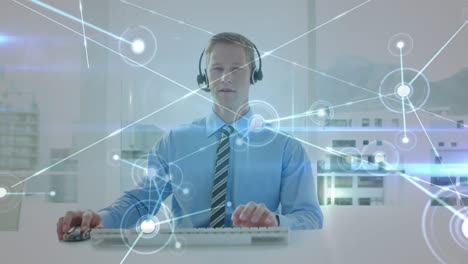 Animation-of-network-of-connections-over-businessman-wearing-phone-headset