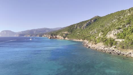 summer holiday destination - sunny sardinia coastline aerial dolly in