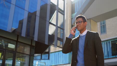 Businessman-talking-on-mobile-phone-in-street-4k