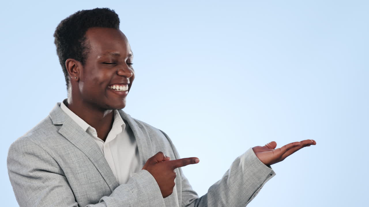 Happy black man, palm and pointing in advertising
