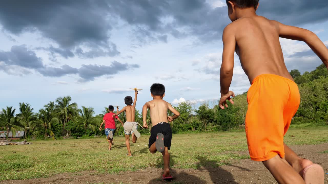 Children Playing with Toy Planes Outdoors