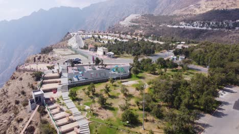 Aerial-view-over-the-Raghadan-Forest-Park,-in-sunny-Saudi-Arabia---tilt,-drone-shot