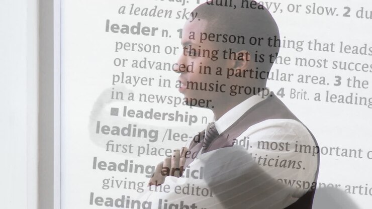 Animation of text over african american businessman on white background