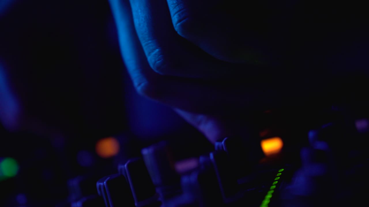 DJ Mixing Music at Night