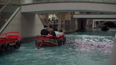 boat ride through an indoor canal in a shopping mall