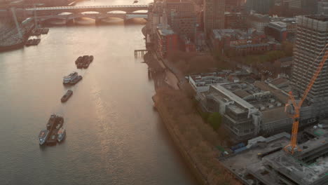 pan up aerial shot over the south bank towards london skyscrapers