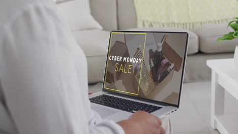 Biracial-Frau-Nutzt-Laptop-Zu-Hause-Für-Online-Shopping-Am-Cyber-Monday,-Zeitlupe