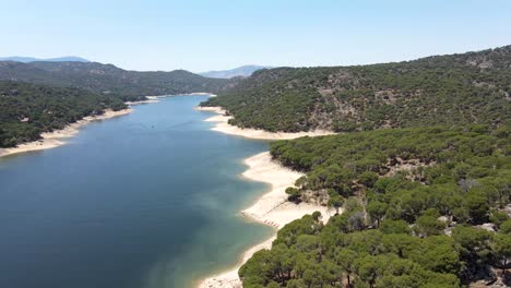 aerial walkthrough above the san juan reservoir on a spectacular sunny day of summer