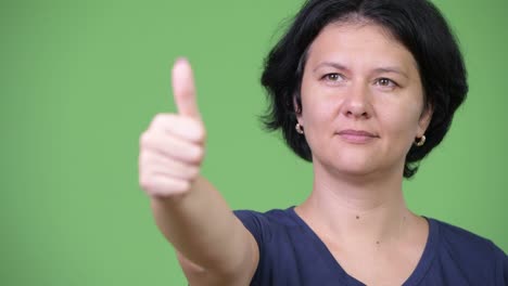beautiful woman with short hair giving thumbs up