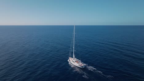 luxury white oyster 82 yacht navigating on blue sea waters with horizon in background, sky for copy space