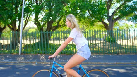 woman riding a bicycle in the street 4k