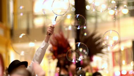 blowing soap bubbles at a children's party.