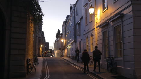 view along street in oxford city centre at dusk