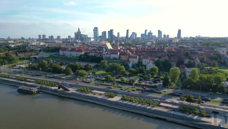 Aerial-panorama-of-Warsaw,-Poland-over-the-Vistual-river-and-City-center-in-a-distance-Old-town