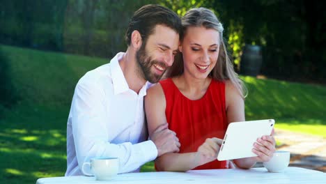 couple using digital tablet in a restaurant 4k