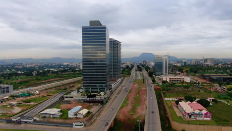 shot of a road and cars passing in the city of abuja, nigeria