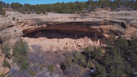 aerial shot of a cave in the cliffside