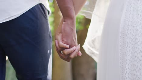 Close-up-of-married-african-american-couple-holding-hands