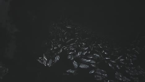 drone shot flying over frozen lake covered in ice and snow flying away from chunks of ice