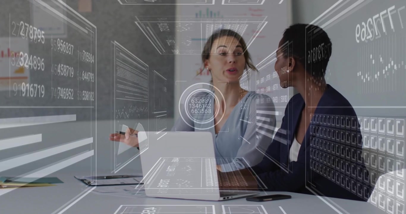 Businesswoman clicking laptop trackpad while colleague analyzing animated graphs for data analysis