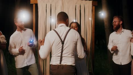 couple dancing at a rustic outdoor wedding reception