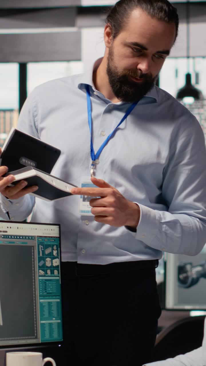 Team leader supervising work done by engineer creating solar cell energy device