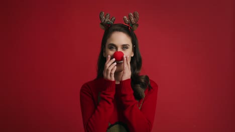 woman in christmas costume on red background