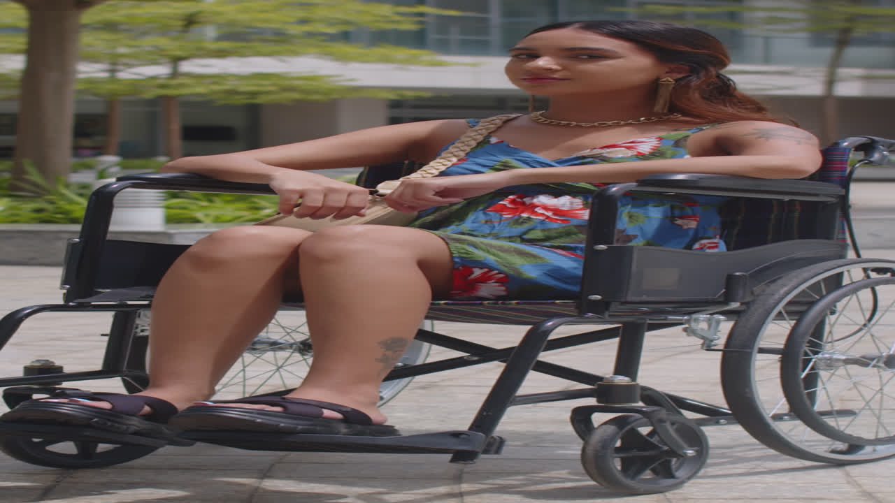 Young Woman in Wheelchair Smiling Outdoors
