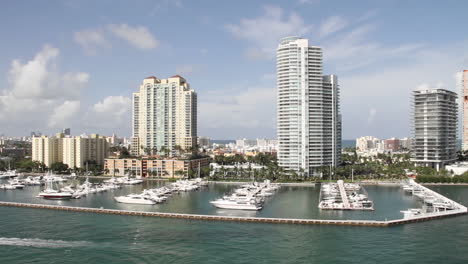 wide shot miami florida high rise apartments from the pov from a cruise ship