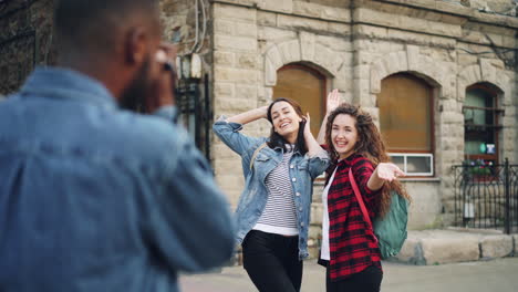 friends posing for a photo on a city street