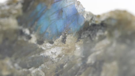 macro shot of quartz rock with rough edges spinning around showing texture on surface