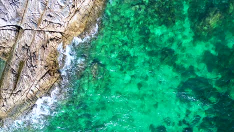 Crystal-clear-water-on-rocky-sandy-thai-island-beach